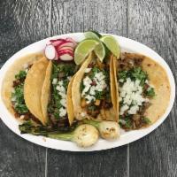 Tacos  · Each. Served with choice of meat, onions, and cilantro. Cerne, cebolla, y cliantro.