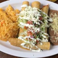 Flautas · Flautas rolled chicken in fried tortilla, lettuce, pico, cheese, cream, rice and beans. Poll...