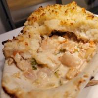 Fisherman's Pie · Cod, shrimp, clams and scallops in a lemon cream sauce covered with mashed potatoes.