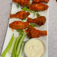 Wings · Buffalo, BBQ, Mango Habanero, Garlic Parmesan and Sweet chillie. Served with blue cheese and...