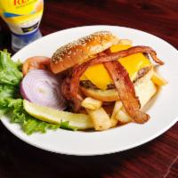T.D.C. Burger · 8 oz. Angus beef on a bun with cheese. Served with fresh lettuce, sliced tomatoes, onions an...