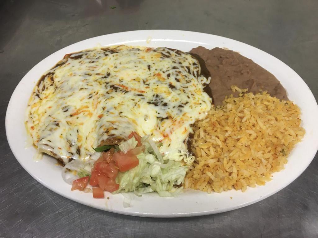 Enchiladas Dinner Special · Three corn tortillas dipped in our homemade enchilada sauce, stuffed with your choice of filling, and topped with cheese. Served with rice and beans. 