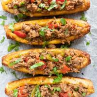 Sweet Plantain Canoe · Sweet Plantain filled with beef and mozzarella cheese. 