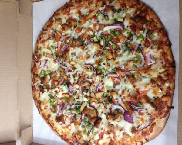 7. Rosemary Chicken Pizza · Tender chicken, red onions, green onions, tomatoes, mozzarella cheese and fresh herbs.