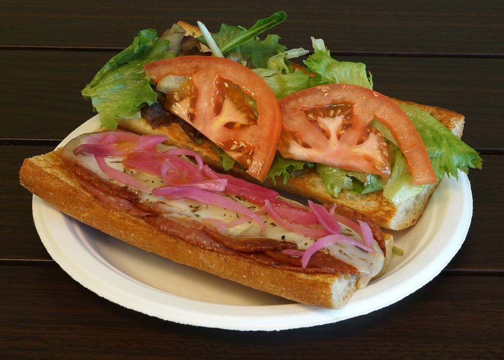 Italian Sub Combo · Salami and pepperoni under provolone with red onions, tomatoes and organic greens on a French baguette. Includes choice of side and drink.