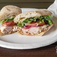 Spicy Melt Sub Combo · Smoked turkey under provolone with roasted red onions, tomatoes, organic greens and spicy sa...