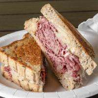 Reuben Sub · Corned beef and sauerkraut under melted Swiss cheese with homemade Thousand Island dressing ...