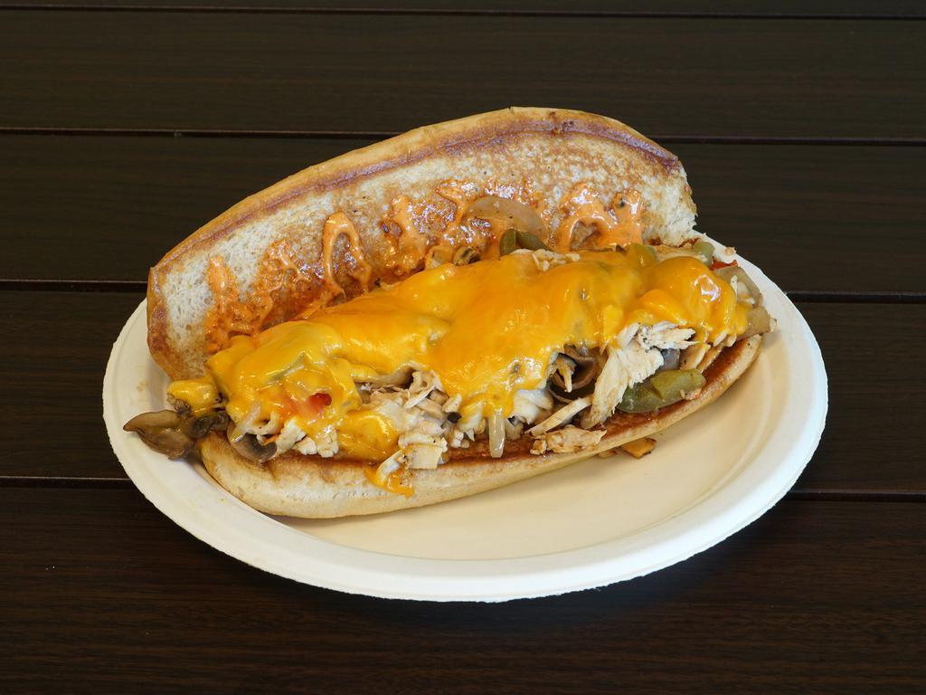 Chicken Philly Sub · Chicken under cheddar with grilled red peppers, green peppers, grilled onions, grilled mushrooms and chipotle mayo on a hoagie roll