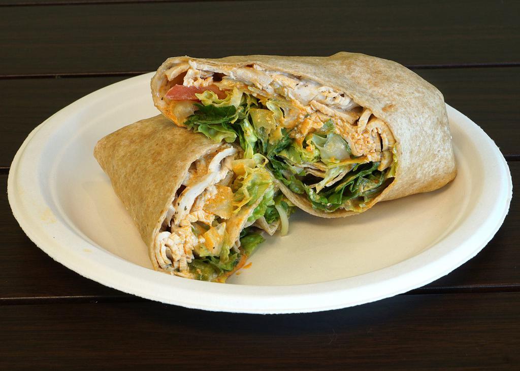 Buffalo Chicken Wrap Combo · Chicken under blue cheese with Buffalo sauce, ranch, celery, romaine lettuce and tomatoes on a wheat wrap. Includes choice of side and drink.