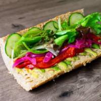 Veggie Sub · House made hummus, avocado, roasted red peppers, cucumbers, red onions, organic greens and I...