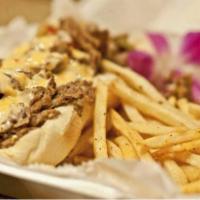 Steak Philly · Sweet peppers, American cheese and Chef Skip's house sauce. Served on a bun or over fries.