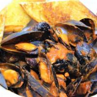 Mussels Marinara · 1 lb. of mussels cooked in marinara, side salad and garlic bread.