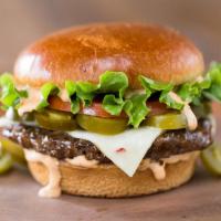 The Spicy Houston Burger · Spicy jalapenos, pepper jack cheese, crisp leaf lettuce, fresh tomato, and our smokin' chipo...