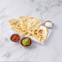 Quesadilla · Grilled flour tortilla with Monterey Jack cheese and salsa garnished with guacamole and sour...