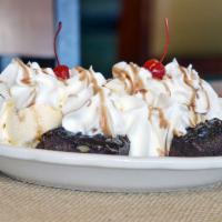 Brownie Sundae · Hot homemade brownie topped with ice cream, chocolate sauce and whipped cream.