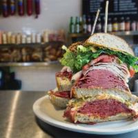 The Monster Sandwich (FEEDS 2 TO 4 or ONE HUNGRY PERSON) · New York's Biggest Sandwich. Served on thick sliced rye bread, with corned beef, pastrami, s...