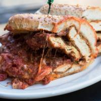 Chicken Parm Sandwich · Fried chicken cutlet, topped with melted mozzarella cheese, and tomato sauce on a toasted ga...