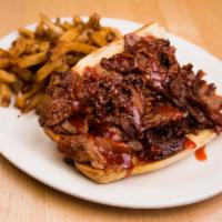 BBQ Slow Cooked Brisket Sandwich · Slow cooked and smoked served on a garlic herb. Served with sarge's famous crinkle cut fries.