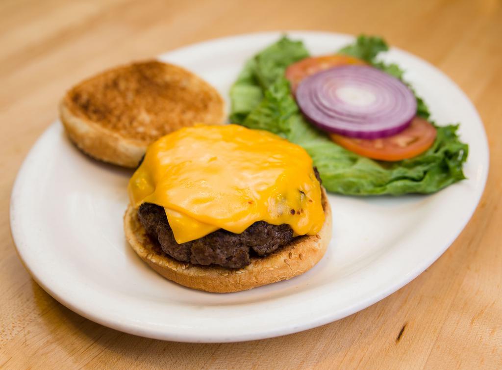 Cheeseburger · Freshly ground prime beef burger topped with melted american cheese. Served with lettuce, tomato & onion.