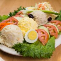 Combo Salad Platter · Egg salad, tuna salad with lettuce, tomato, potato salad, coleslaw and sliced egg.