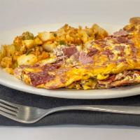 Delicatessen Omelette · Three farm fresh egg omelet with assorted delicatessen meats lightly grilled.