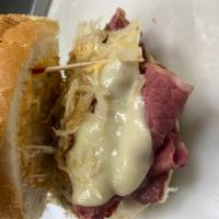 Ruben Specialty Sandwich · Grilled boar’s head corned beef with boar’s head sauerkraut, melted boar’s head imported Swi...