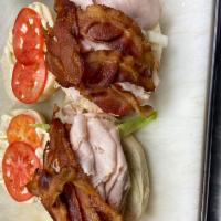 Turkey Club Specialty Sandwich · Boar’s head oven golds turkey with crispy bacon, lettuce, tomatoes, and boar’s head real may...
