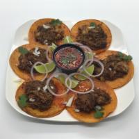 12 Taquitos de Birria · Seasoned shredded meat, slightly spicy, served with their own broth.