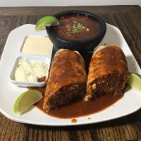 1 Burrito de Birria · Seasoned shredded meat, slightly spicy, served with their own broth.