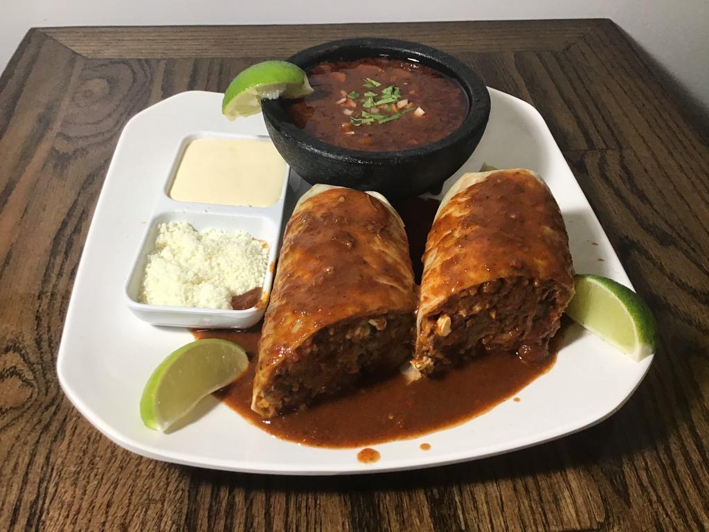 1 Burrito de Birria · Seasoned shredded meat, slightly spicy, served with their own broth.