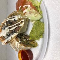Chorizo Burrito · Mexican sausage. Flour tortilla rolled up, filled with rice, beans, cheese and topped with s...