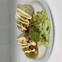Pollo Burrito · Chicken. Flour tortilla rolled up, filled with rice, beans, cheese and topped with sour crea...