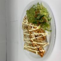 Carnitas Quesadilla · Fried pork. Large flour tortilla folded, filled with melted cheese and topped with sour crea...