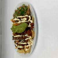 Carnitas Nachos  · Fried pork. Crispy corn tortilla spread with refried beans and melted oaxaca cheese. Topped ...