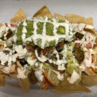 Shrimp  nachos  · Crispy corn tortilla spread with refried beans and melted oaxaca cheese. Topped with lettuce...