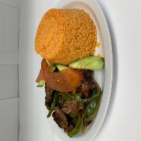 Bistec Over Rice · Steak. Sauteed with onion and bell peppers. Served with rice and salad.