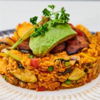 Vegan Paella · Rice, portobello mushroom, zucchini, corn, peas, peppers, onions and avocado.