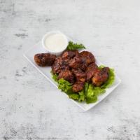 10 Piece Boneless Chicken Bites · With choice of sauce.