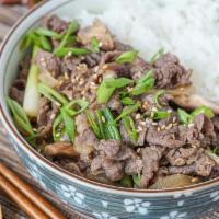 Bulgogi Deopbap · a rice bowl topped with marinated, thinly sliced beef.