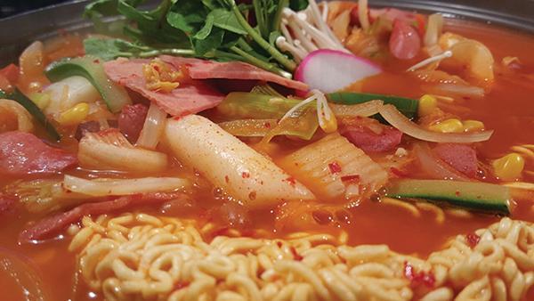 Boodae Jjigae · (Korean Army Stew) Spicy Ham and Assorted Sausage Stew with Ramen (ramen noodles are not cooked and packaged separately)