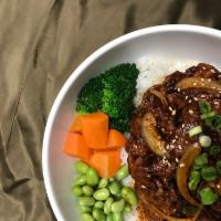 Spicy Pork Dup Bop · Served marinated spicy pork over rice with vegetable(carrot, edamame and broccoli)