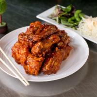 Fried Chicken · Korean-style fried chicken. It is fried very crispy and comes with pickled radish. It will b...