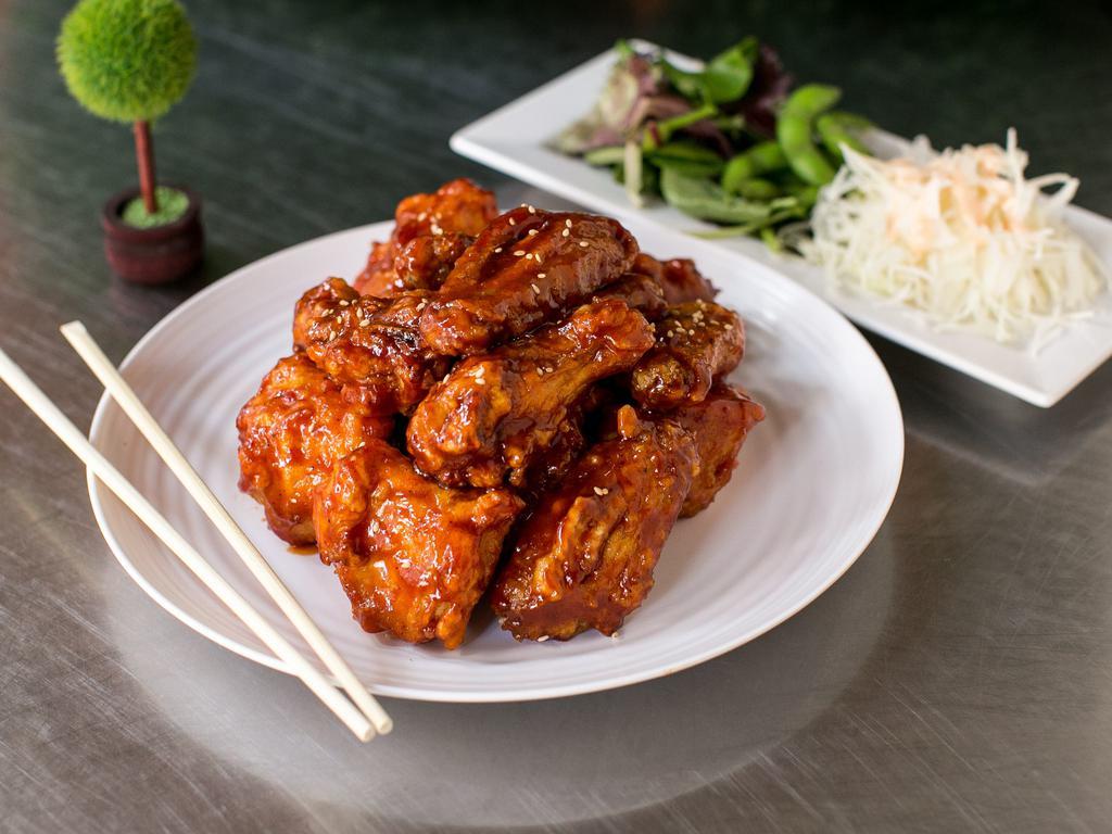 Fried Chicken · Korean-style fried chicken. It is fried very crispy and comes with pickled radish. It will be delivered with sauce on the side if you want to sauce on it let us know.