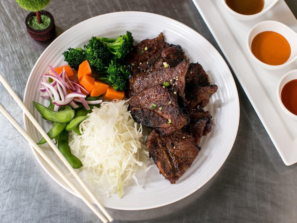 Galbi (Beef short rib) · Grilled premium beef short rib. Served with rice and vegetables.