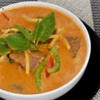 Red Curry · Bamboo shoots, bell peppers, Thai basil leaves and choice of meat in red chili curry sauce. ...