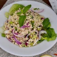 Laarb Salad (Minced Meat) · Minced meat tossed with mints, red onions, green onions, and Thaisian laarb powder served on...