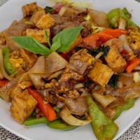 Pad Kee Mao / Drunken Noodles · Flat rice noodles with a choice of meat, egg, tomatoes, white onions, bell peppers, and Thai...