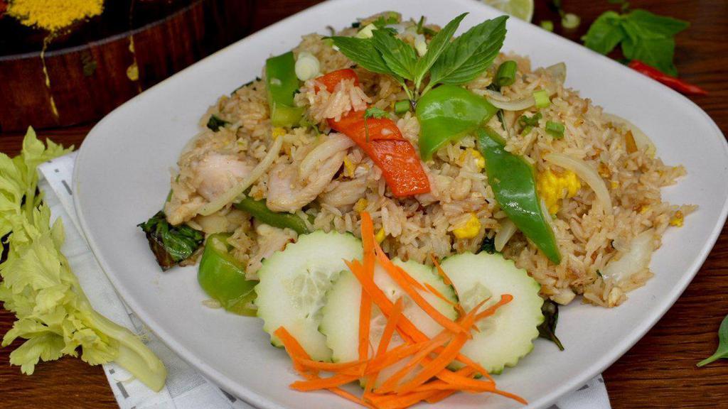 Basil Fried Rice · Fried rice with choice of meat, egg, Thai basil leaves, bell peppers and white onions served with cucumbers.