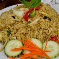 Green Curry Fried Rice · Fried rice with green curry paste, choice of meat, egg, bamboo shoots, green bell peppers, T...
