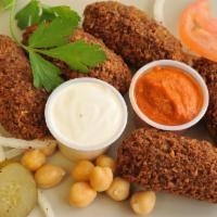 Falafel Side 6 · Chickpeas, onion, garlic, parsley, cilantro and mom's secret spices ground together and deep...